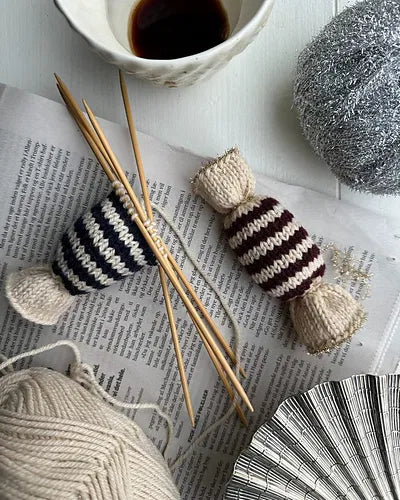 Two knitted strippy caramels