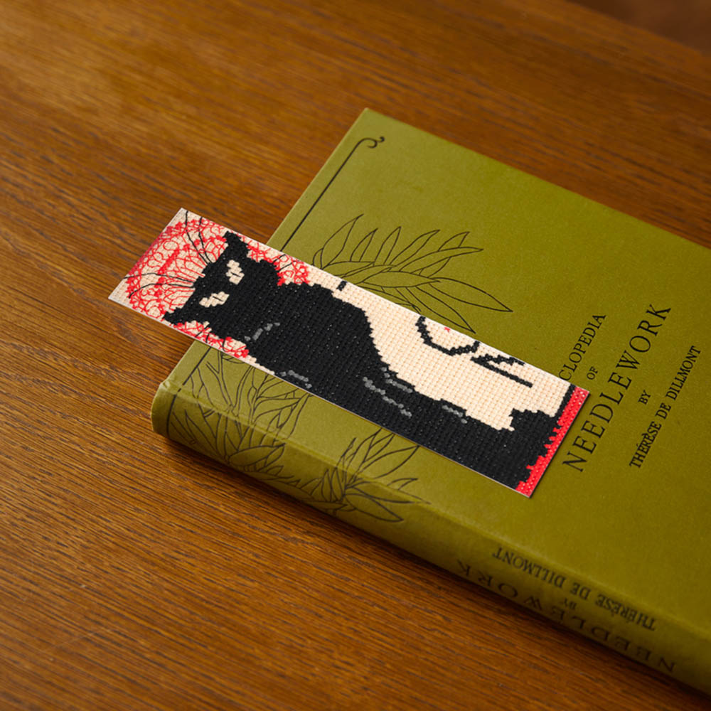 Black Cat Cross Stitch Bookmark Kit, in a book