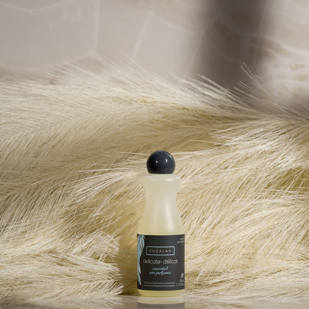 Eucalan Unscented Wool Wash 100 ml, styled on a sheepskin